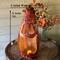 A handmade spooky pumpkin gourd to with an extra large mouth. This ghostly pumpkin is 16 inches tall and 6 inches wide